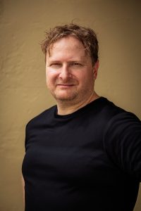 portrait headshot of Michael Sams